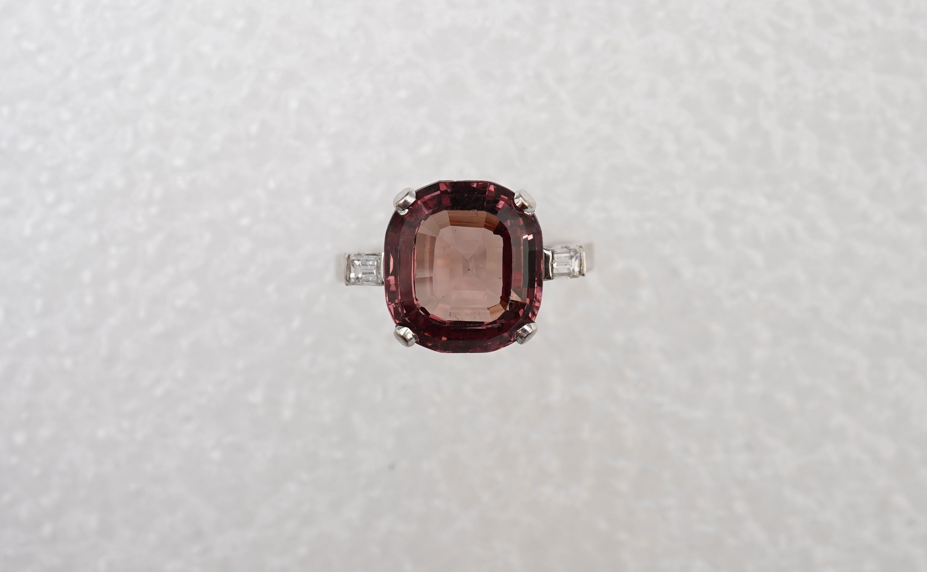 A garnet and diamond ring